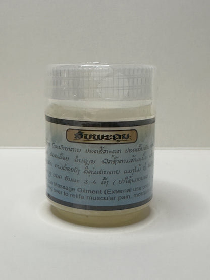 Jar of Lao Herbal massage oil Kanoukham Peppermint Ointment with a label on a white background, usage instructions in Laos