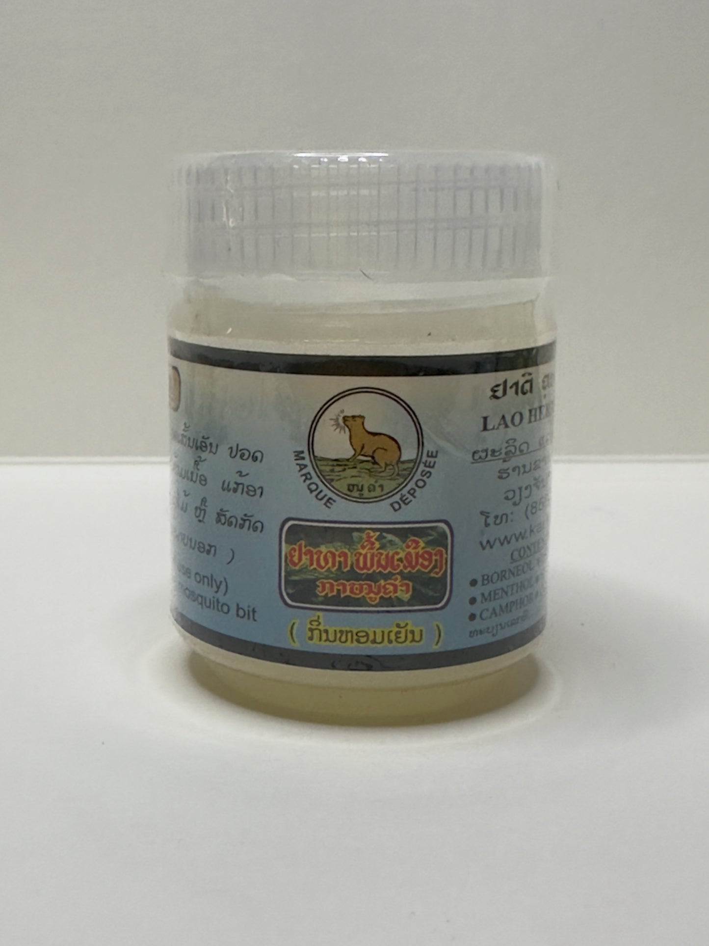 Jar of Lao Herbal Remedy Kanoukham Peppermint Oil Massage Balm with a label on a white background