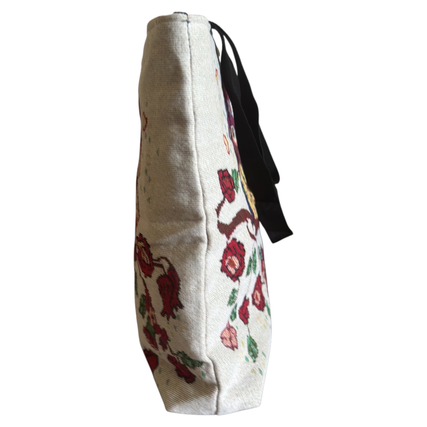 Floral embroidered bag with a strap on a white background